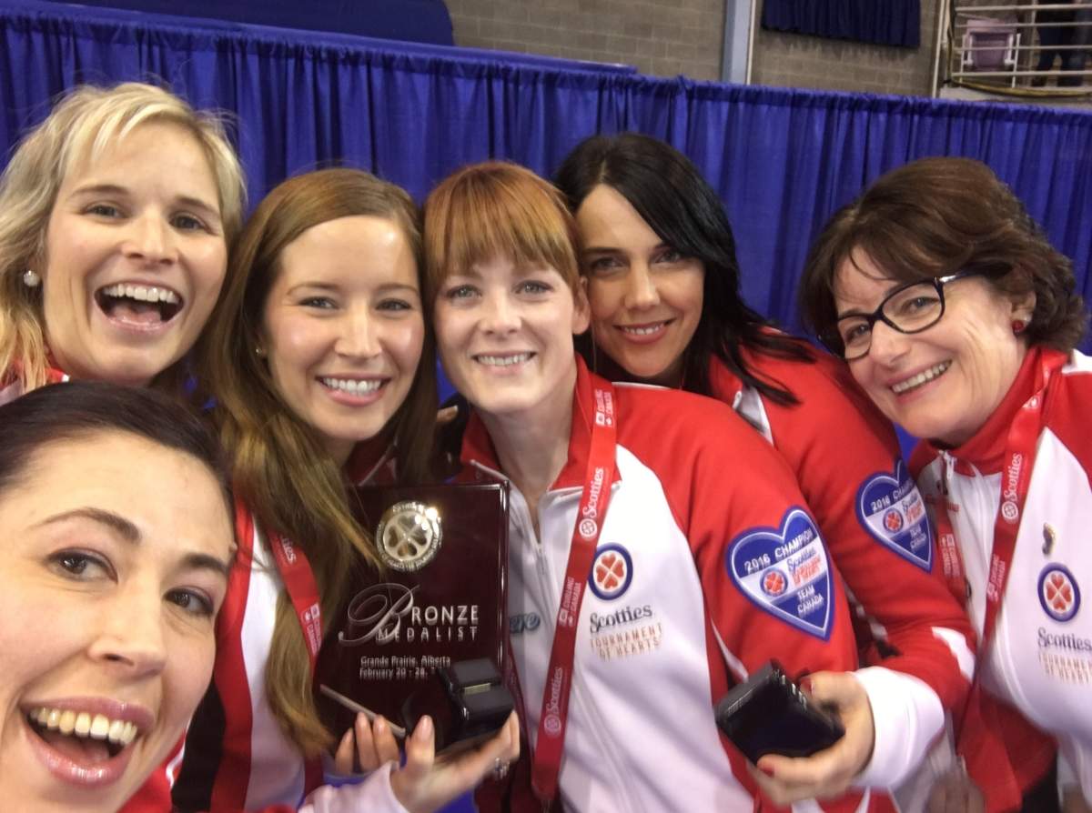 Team Canada poses for a selfie on the podium at the 2016 Scotties Tournament of Hearts where they won bronze.