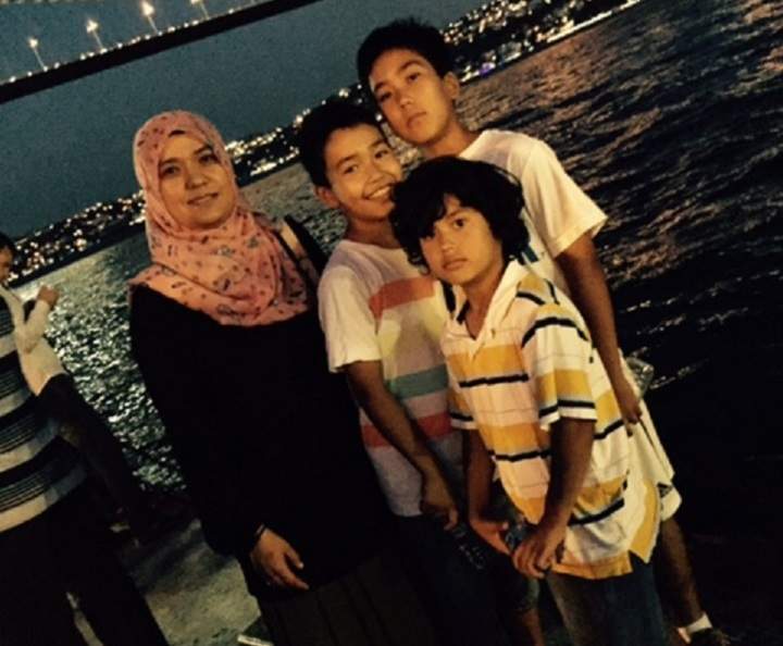 Kamila Telendibaeva is seen with three of her sons in this undated family photo.