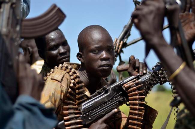 In this file photo of Friday, Sept. 25, 2015. South Sudan government soldiers in the town of Koch, Unity state, South Sudan.