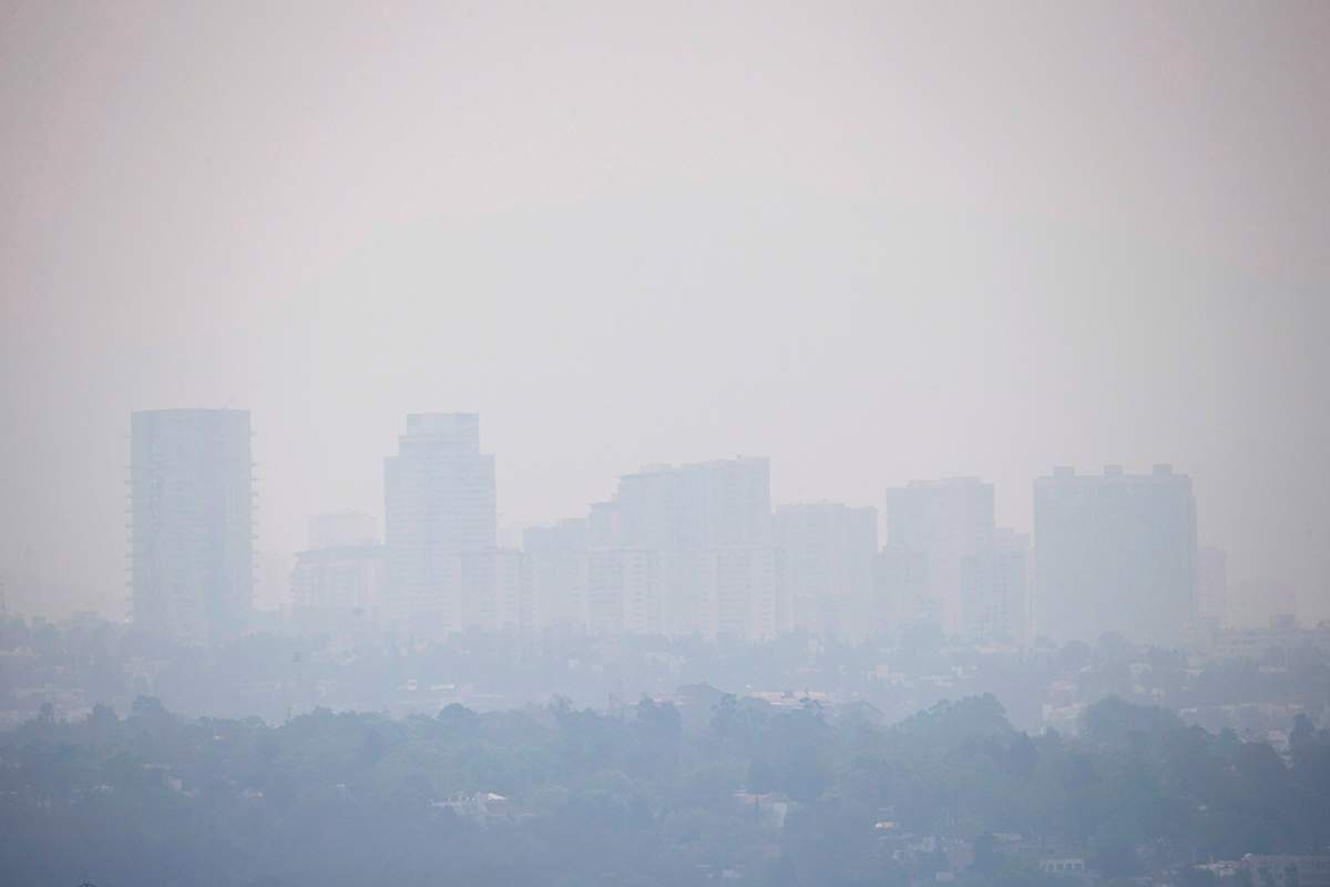In this Wednesday, March 16, 2016, haze hangs over Mexico City. 