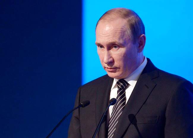 Russian President Vladimir Putin speaks at a meeting of the Russian Chamber of Commerce in Moscow, Russia, Tuesday, March 1, 2016. Russian officials say the U.N. human rights office in Moscow is closing.