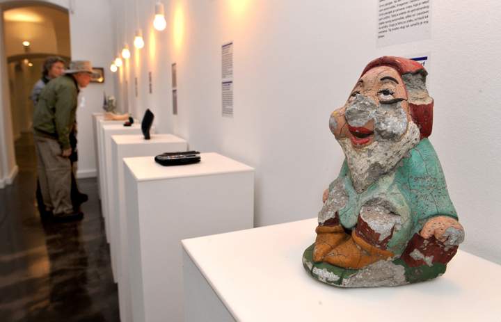 Visitors look at items presented during the opening of the Museum of Broken Relationships in Zagreb, on October 6, 2010.