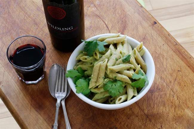 Pasta with speedy no-cook avocado sauce and fresh cilantro.