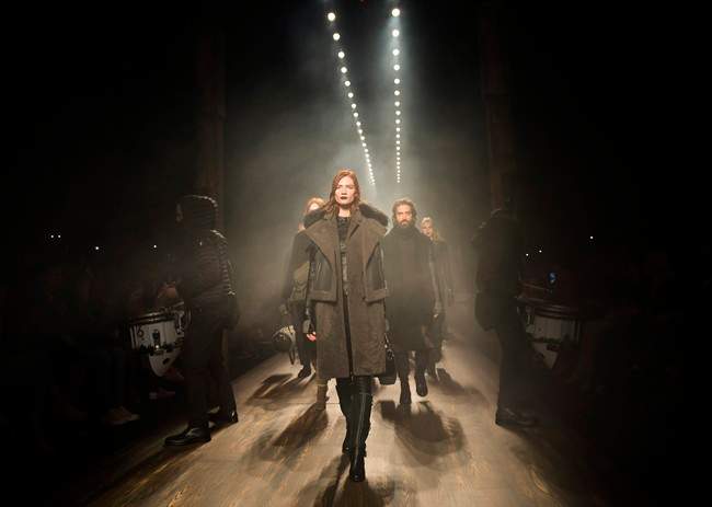 Models walk the runway for the Rudsak collection during Toronto Fashion Week in Toronto on Thursday, March 17, 2016. 