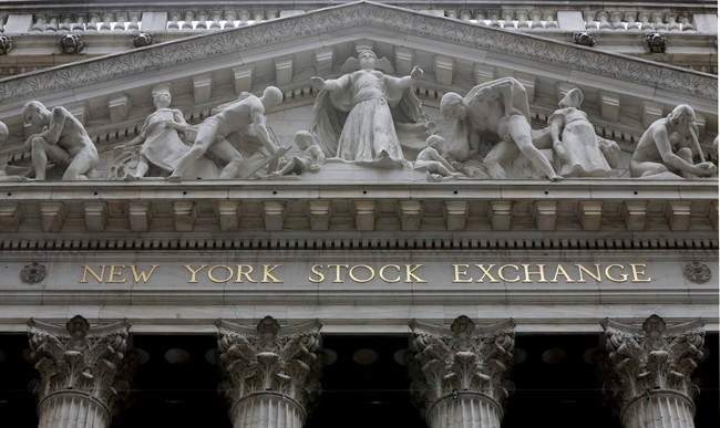 This Oct. 4, 2014, file photo, shows the facade of the New York Stock Exchange. Stocks are off to a mixed start Monday, March 21, 2016.