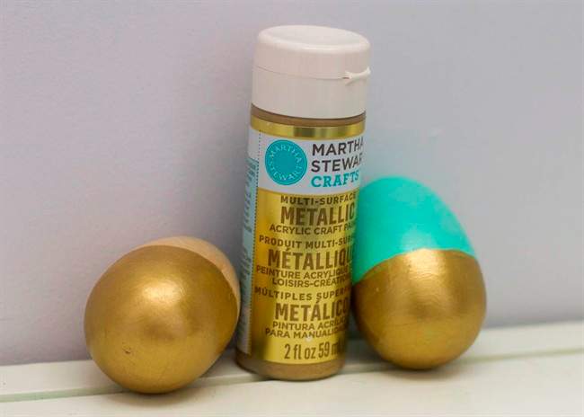 This Wednesday, March 9, 2016, photo shows two wooden Easter eggs decorated using acrylic paint. This was the most inexpensive of the three tested techniques but required multiple coats of paint to achieve opaque coverage.