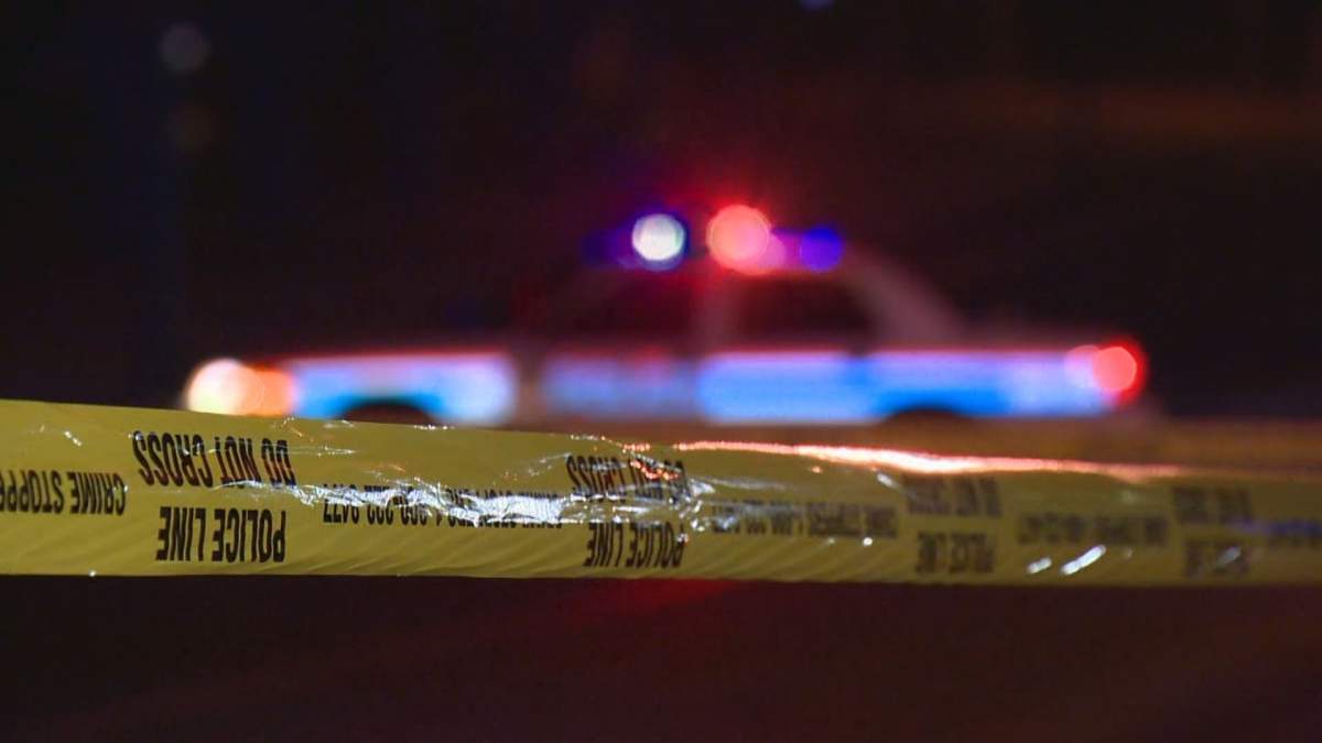 File photo of police tape and cruiser.