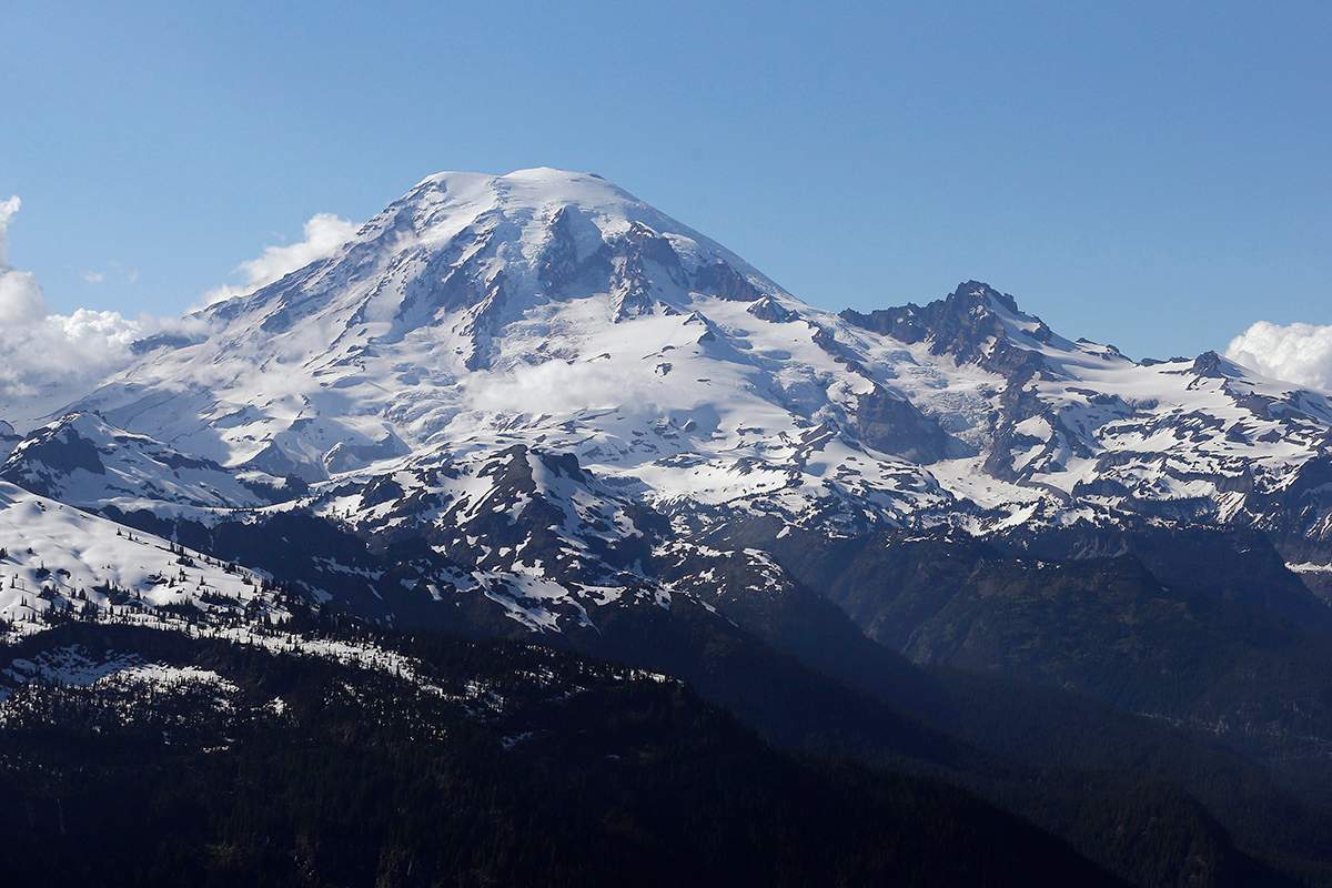 In this file photo taken June 19, 2013, Mount Rainier is seen from a helicopter flying south of the mountain and west of Yakima, Wash.