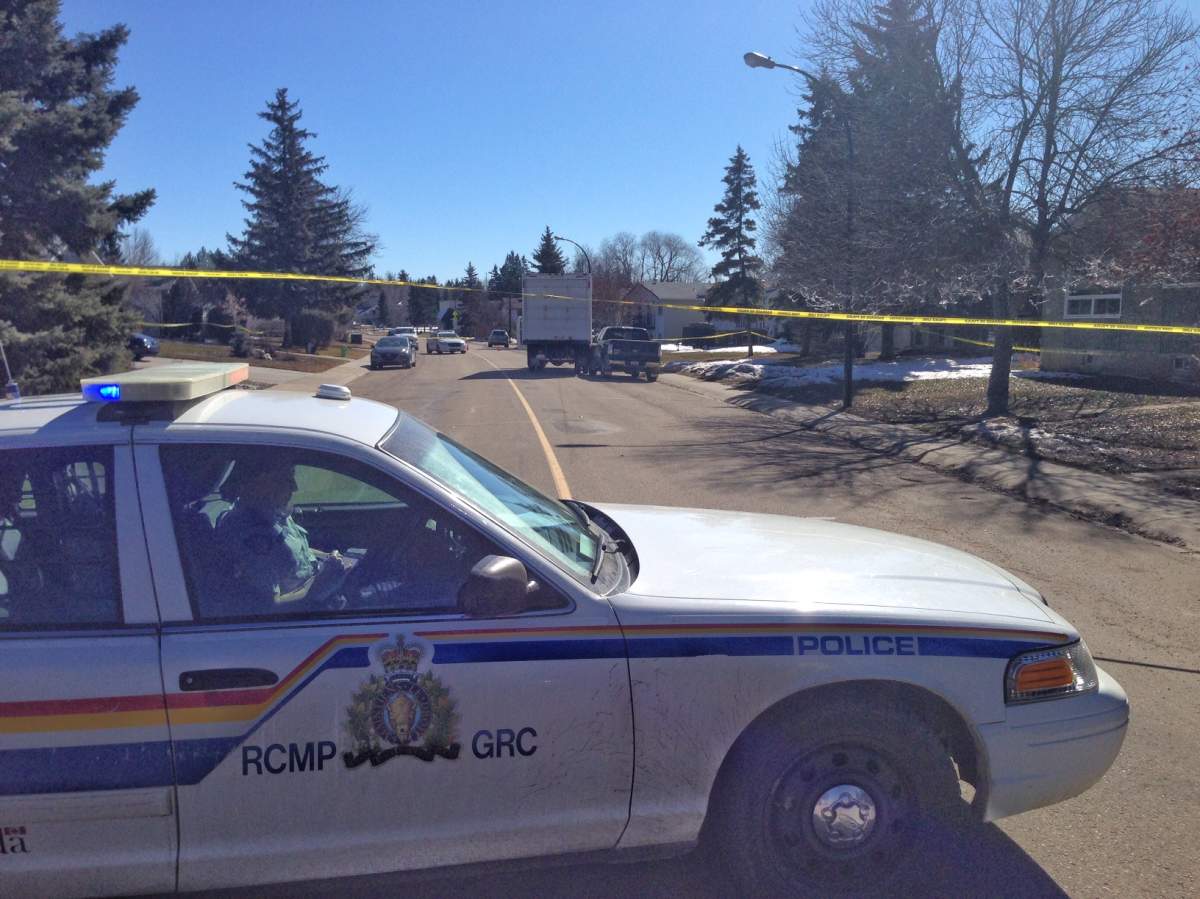 RCMP block off a cube van along Page Avenue in the community of Pines Wednesday.