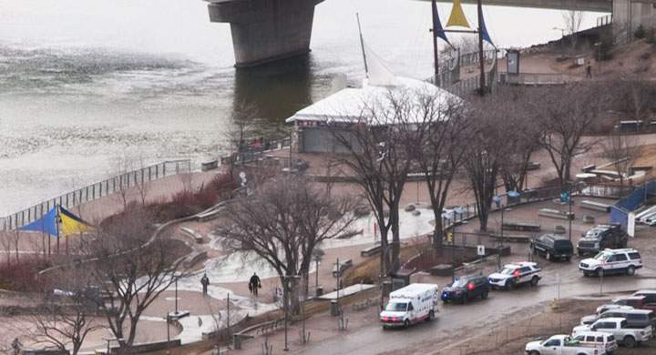 A Saskatoon police officer entered the icy South Saskatchewan River Wednesday afternoon to rescue a woman.