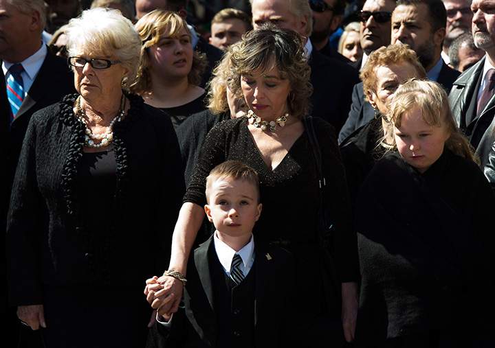 Mother Diane Ford, left to right, son Doug Ford Jr., wife Renata Ford and daughter Stephanie Ford wait outside city hall ahead of the funeral procession to St. James Cathedral for former mayor Rob Ford in Toronto on Wednesday, March 30, 2016.
