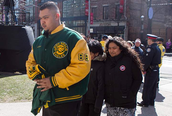 A man wearing a Don Bosco Eagles football jacket arrives at Toronto’s St. James Cathedral for Rob Ford’s funeral service on Wednesday, March 30, 2016.
