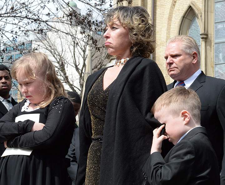 Former Toronto mayor Rob Ford’s widow, Renata, their children Stephanie and Dougie and Ford’s brother Doug, leave St. James Cathedral in Toronto following Ford’s funeral on Wednesday, March 30, 2016.