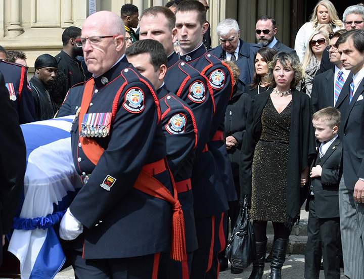 The casket of former Toronto mayor Rob Ford is carried from St. James Cathedral in Toronto on Wednesday, March 30, 2016.