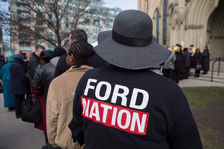 Members of the public queue outside Toronto’s St. James Cathedral to attend former mayor Rob Ford’s funeral on Wednesday, March 30, 2016.
