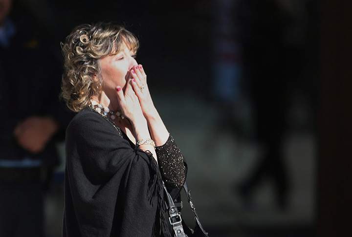 Rob Ford’s widow, Renata, blows kisses to Ford supporters as she arrives at city hall ahead of the funeral procession to St. James Cathedral in Toronto for the funeral of former mayor Rob Ford on Wednesday, March 30, 2016.