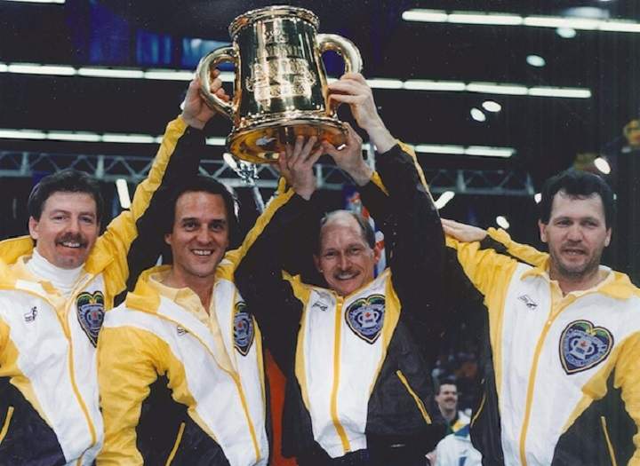 Vic Peters (left) and his Granite Curling Club based team hoist the 1992 Brier championship trophy.