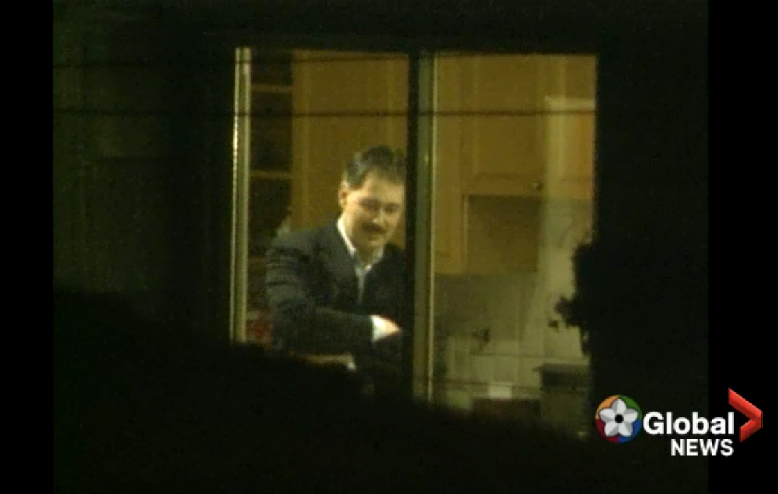 A Global News/BCTV camera shows Glen Clark in his home as RCMP search the building on March 2, 1999.