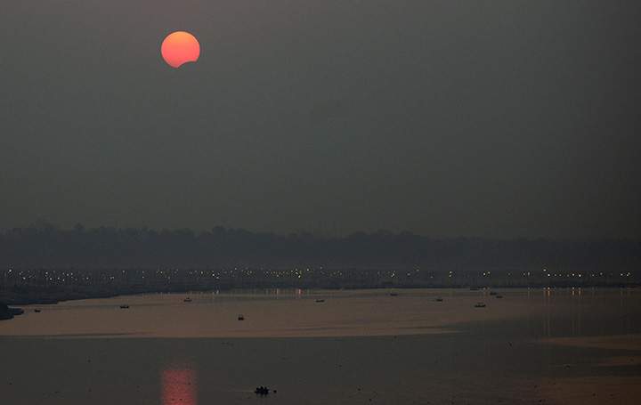 A partial solar eclipse is seen over Sangam, in Allahabad on March 9, 2016.