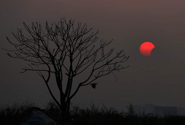 A partial solar eclipse is seen from Dhaka, Bangladesh, Wednesday, March 9, 2016.