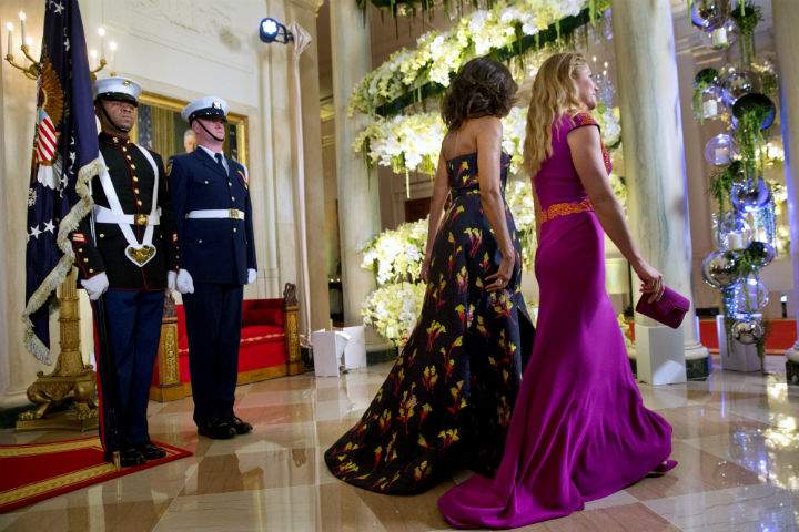 First lady Michelle Obama and Sophie Grégoire Trudeau walk through the White House as they follow their husbands President Barack Obama and Canadian Prime Minister Justin Trudeau to the State Dinner in Washington, Thursday, March 10, 2016