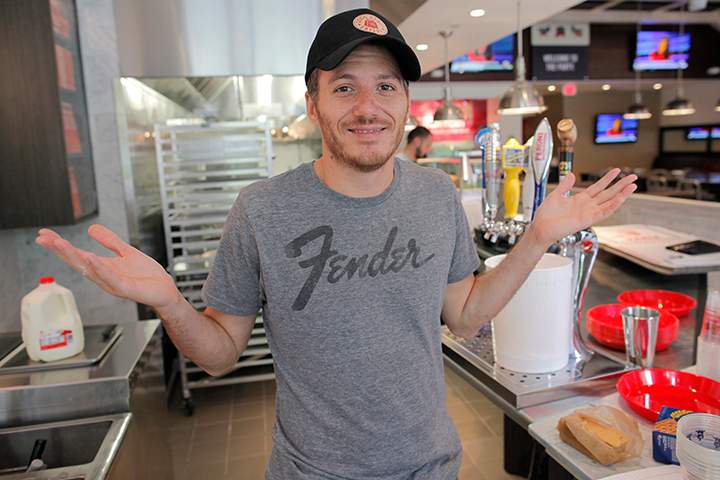 In this May 7, 2012 file photo, French-Canadian celebrity chef Spike Mendelsohn gestures at his new Good Stuff Eatery restaurant in Crystal City, Arlington, Va. 
