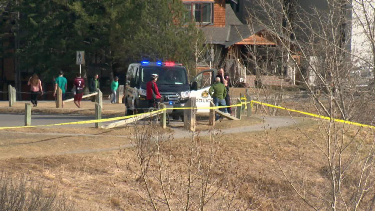 Police tape near the intersection of 37 Avenue and 2 Street SW.