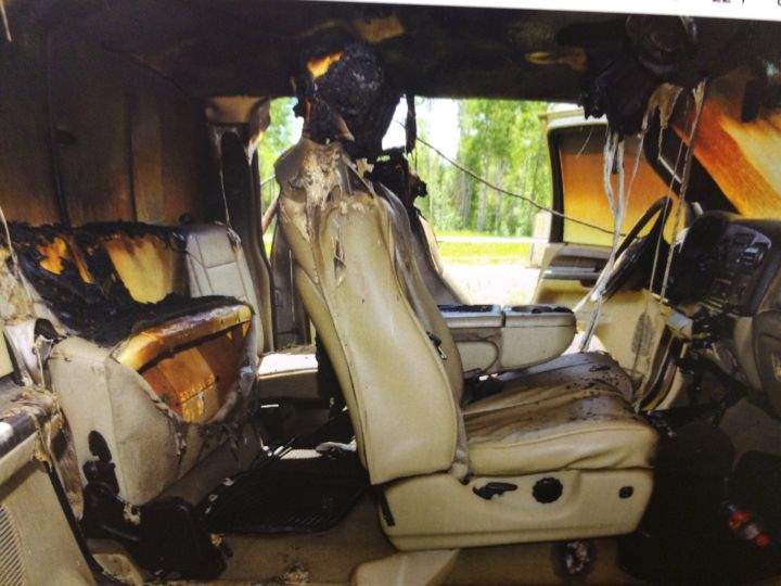 A photo of a burned out pickup truck is submitted as evidence in Travis Vader's murder trial.