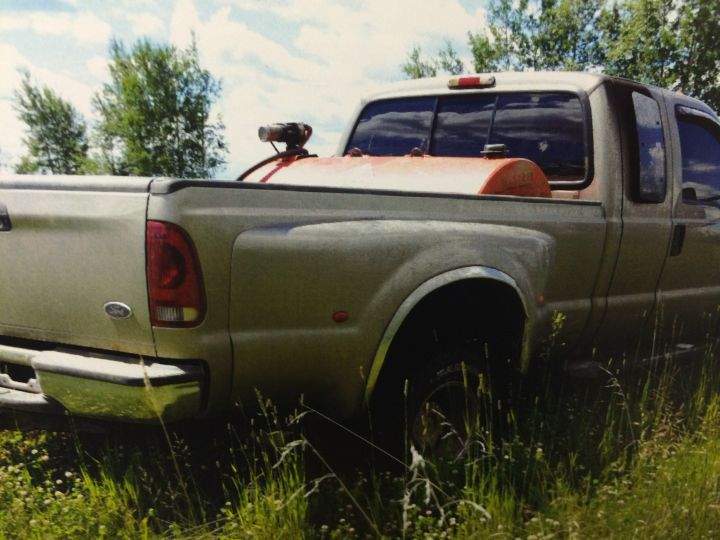 A photo of a pickup truck found at a salvage yard is submitted as evidence in Travis Vader’s murder trial.