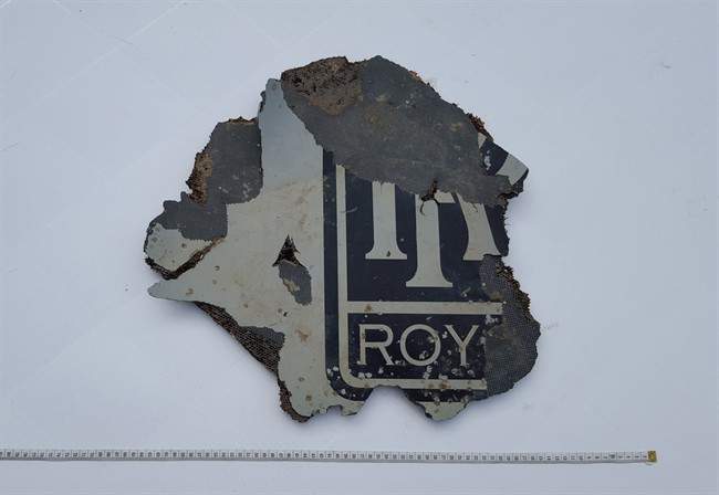 FILE - In this Monday, March 21, 2016, a part of a plane is photographed in Mossel Bay, near Cape Town, South Africa. The part which may be part of a plane engine has been found on the southern coast of South Africa and will be checked to see if it belongs to Malaysia Airlines Flight 370, which vanished two years ago, Malaysian Tranport Minister Liow Tiong Lai said Tuesday, March 22, 2016.
