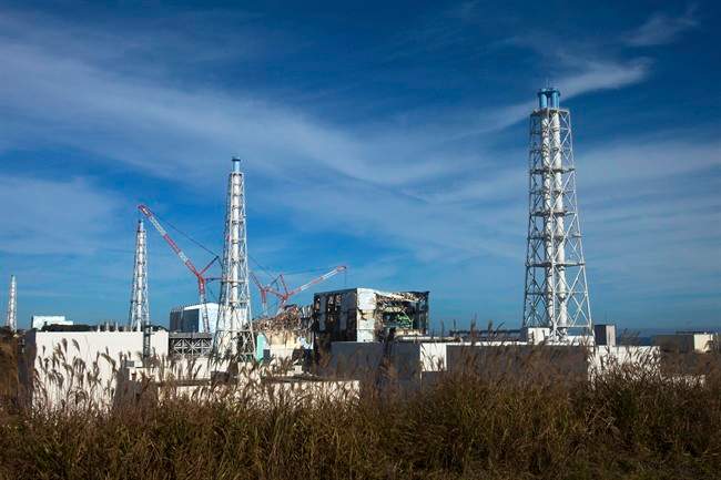 FILE - This Nov. 12, 2011 photo shows a view of the crippled Fukushima Dai-Ichi nuclear power plant in Okuma, Fukushima prefecture, northeastern Japan. After nearly five years of what seemed like an endless battle against the contaminated water at the crippled Fukushima nuclear plant, the utility now has set a 2020 target to put an end to the water woes. (AP Photo/David Guttenfelder, Pool, File).