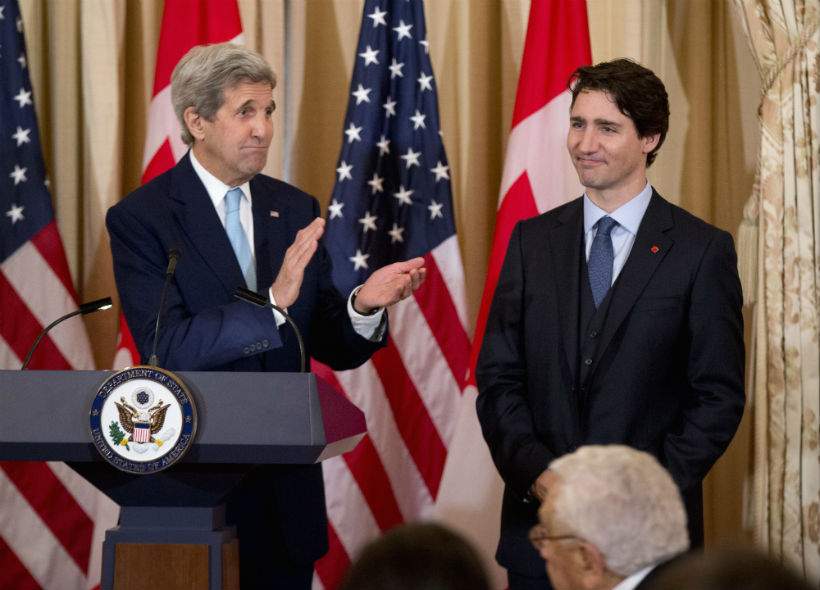 Secretary of State John Kerry applauds Canadian Prime Minister Justin Trudeau during a luncheon meeting at the State Department in Washington, Thursday, March 10, 2016.