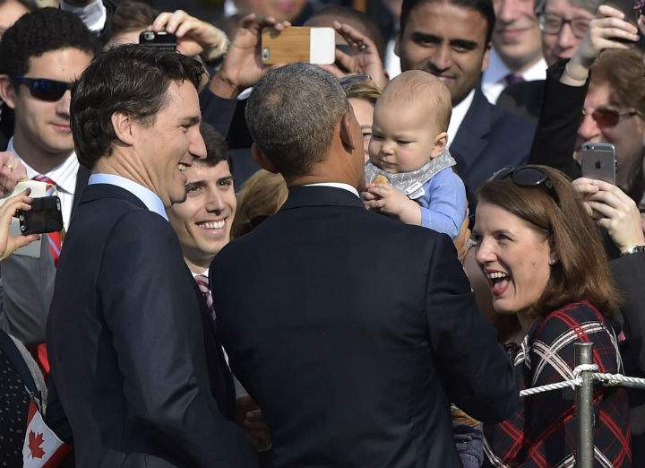 Prime Minister Justin Trudeau and US President Barack Obama greet visitors as they take part in a welcome ceremony during a State Visit on the South Lawn of the White House on March 10, 2016 in Washington, DC.