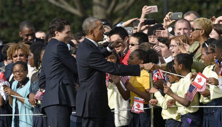 President Barack Obama and Canadian Prime Minister Justin Trudeau greet the crowd during a state arrival ceremony on the South Lawn of White House in Washington, Thursday, March 10, 2016.