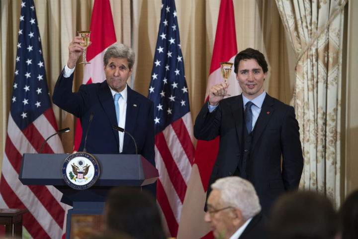 Prime Minister Justin Trudeau makes a toast during a working lunch at the US State Department in Washington, D.C