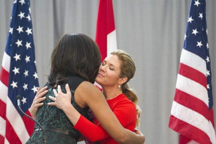 First lady Michelle Obama and Sophie Grégoire-Trudeau hug while they participate in a program at the U.S. Institute of Peace in Washington, Thursday, March 10, 2016, to highlight Let Girls Learn efforts and raise awareness for global girl’s education.