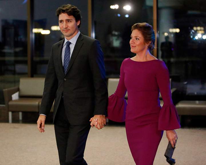 Prime Minister Justin Trudeau, left, and his wife Sophie Gregoire-Trudeau make their way to a dinner hosted for United Nations Secretary General Ban Ki-moon in Gatineau, Que., on Thursday, February 11, 2016. 