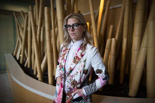 Former WestJet flight attendant Mandalena Lewis stands for a photograph in Vancouver, B.C., on Tuesday March 8, 2016. Lewis, fired after reporting an alleged sexual assault by one of the airline's pilots, says she is shocked at the positive response she's received since sharing her story publicly.