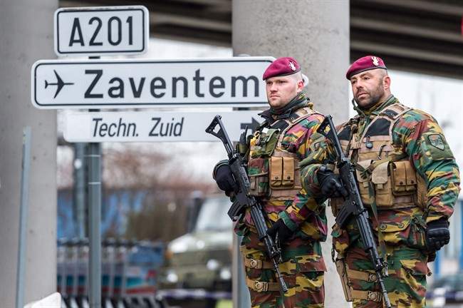 Belgian Army soldiers patrol at Zaventem Airport in Brussels on Wednesday, March 23, 2016. 