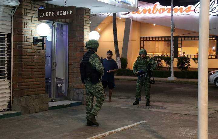 Mexican soldiers patrol following an attack in Acapulco, Mexico, Apr. 25, 2016. 
