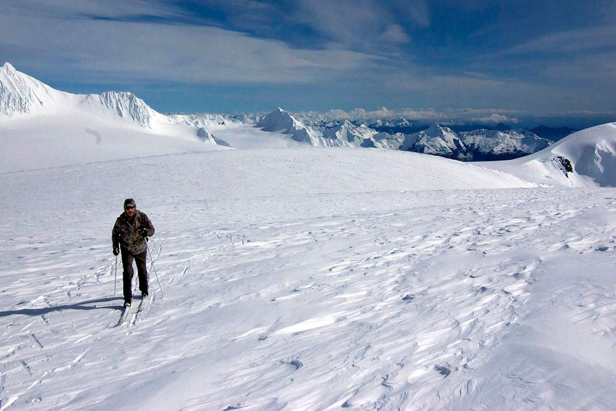 This Friday, April 8, 2016 photo provided by Jenny Neyman shows Chris Hanna, of Soldotna, Alaska, skiing on the Harding Icefield, with the Kenai Fjords and mountains surrounding Seward, in Kenai Fjords National Park, Alaska. 
