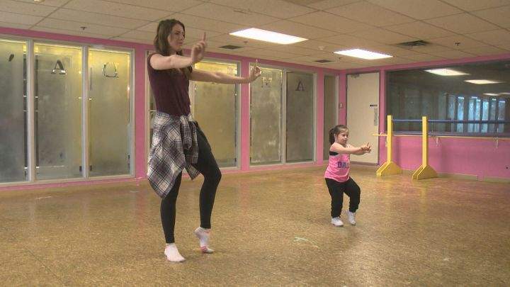 Ana Malaniuk (R) dances with her teacher Shae-Lyn Bates Friday, April 1, 2016.