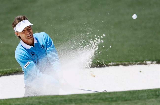 Bernhard Langer, of Germany, hits out of a bunker on the second green during the third round of the Masters golf tournament Saturday, April 9, 2016, in Augusta, Ga.