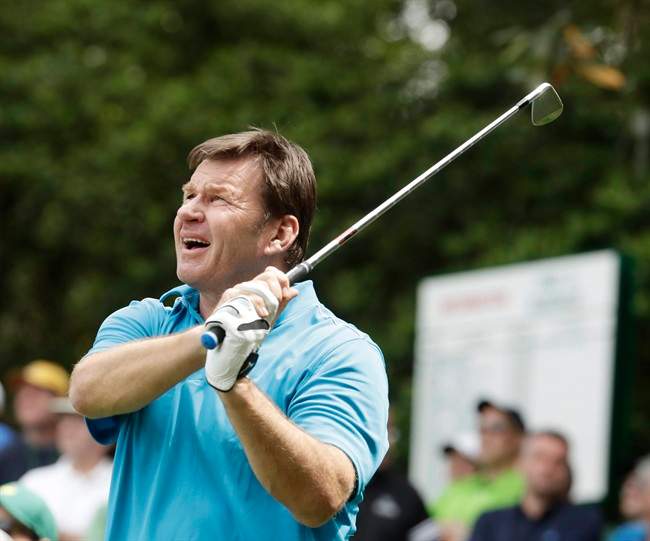 Nick Faldo watches his tee shot on the sixth hole during the par three competition at the Masters golf tournament Wednesday, April 6, 2016, in Augusta, Ga.
