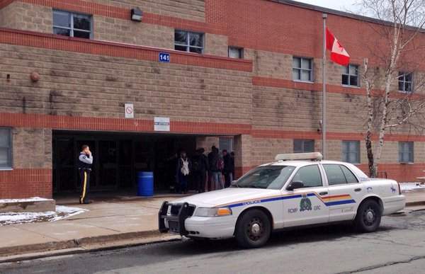 RCMP confirm they seized a bag of weapons and ammunition from the woods near Millwood High. 