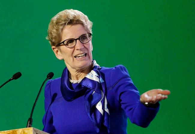 Ontario Premier Kathleen Wynne delivers her speech during a signing ceremony at the COP21, the United Nations Climate Change Conference, Monday, Dec. 7, 2015 in Le Bourget, north of Paris.