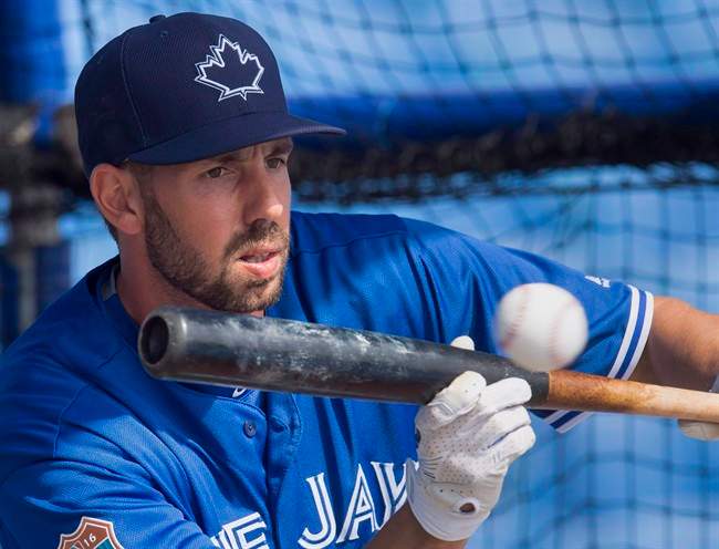 Toronto Blue Jays first baseman Chris Colabello lays down a bunt during batting practice at spring training in Dunedin, Fla., on Wednesday, March 2, 2016. Colabello has been suspended for 80 games without pay after testing positive for a performance-enhancing substance. 