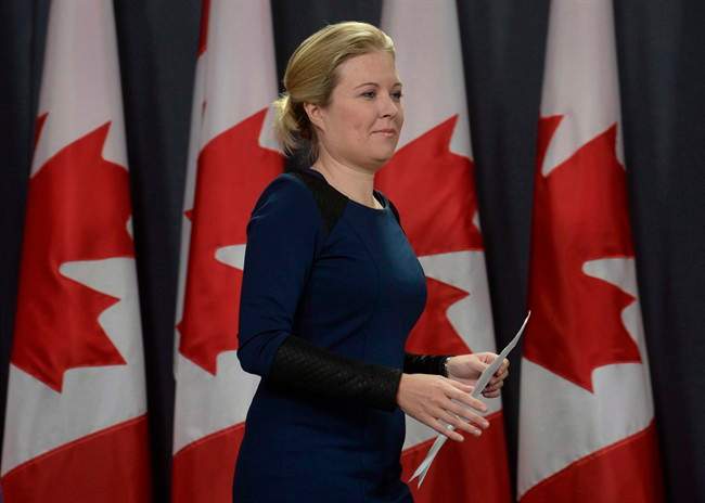Conservative Member of Parliament Michelle Rempel arrives at a news conference about proposed government changes to immigration legislation, Thursday February 25, 2016 in Ottawa.