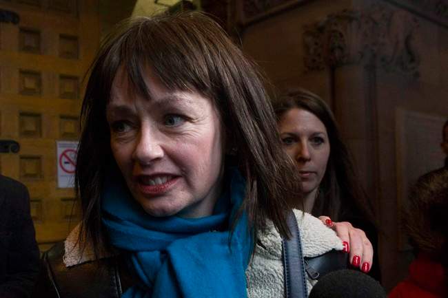 Lucy DeCoutere leaves the Toronto courthouse following the reading of the verdict in the Jian Ghomeshi sexual assault trial on Thursday, March 24, 2016.