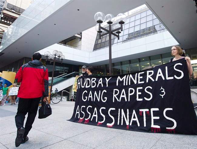 Protesters demonstrate outside the HudBay Minerals Inc. annual general meeting in Toronto. Liberal MP John McKay is calling for stricter oversight of Canadian mining companies abroad as plaintiffs increasingly look to Canadian courts to seek justice. THE CANADIAN PRESS/Nathan Denette.